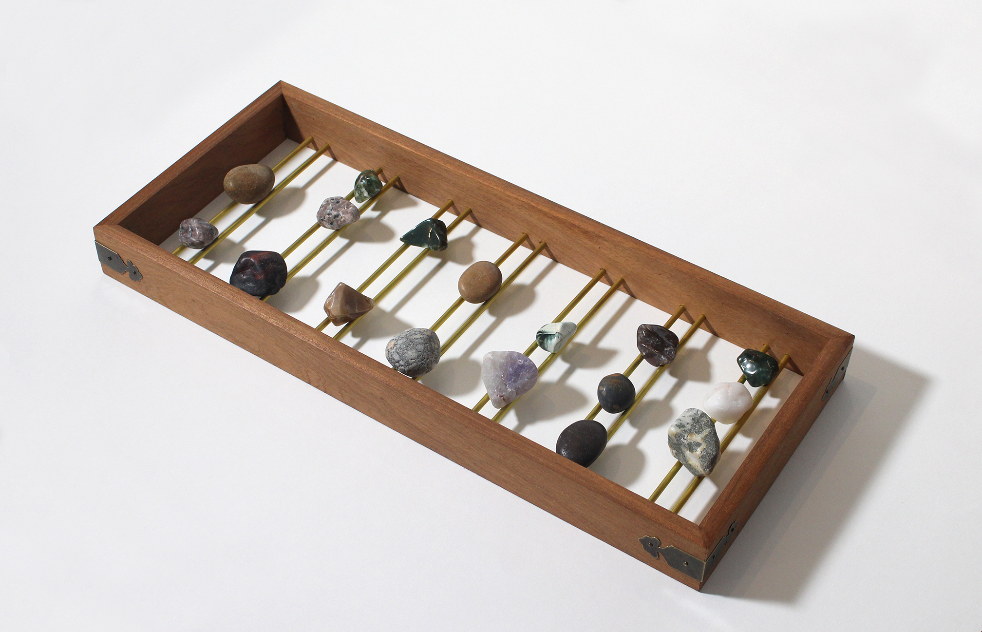 Amy-Jane Blackhall 'Stonecast' 2020, Wood, brass and stone, 19 x 43.5cm
